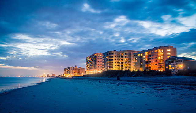 modern apartment buildings on the beach coastline